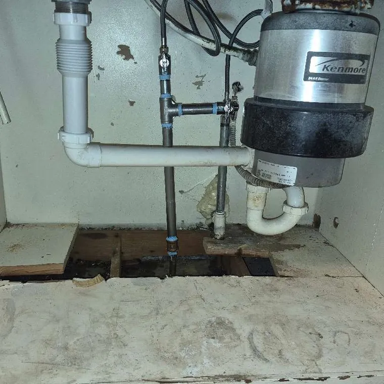 Kitchen water-line repair beneath a sink in Muskogee