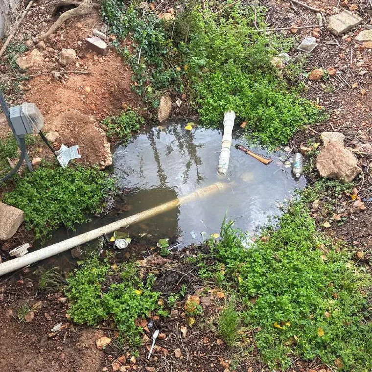 Standing wastewater in yard caused by septic system failure in Tahlequah