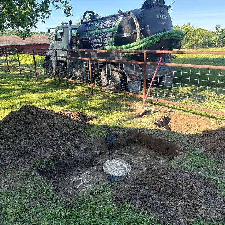 Septic pumping service in Muskogee OK with Clog Hunter truck and exposed septic tank access