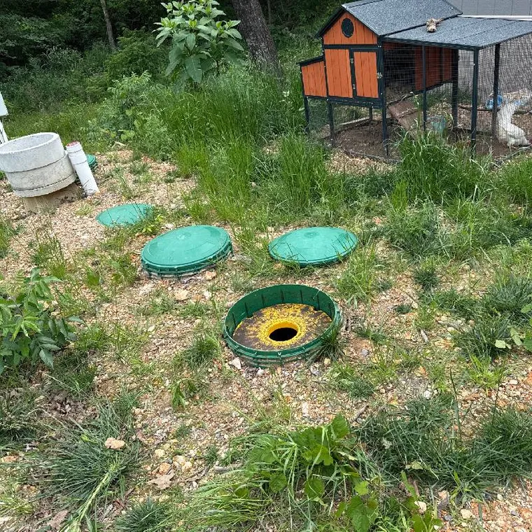 Aerobic septic tank access lids at a residential septic pumping job in Park Hill, Oklahoma