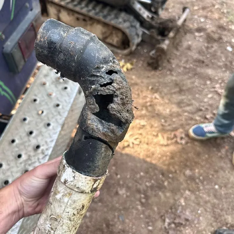Damaged sewer pipe removed during repair in Muskogee, OK