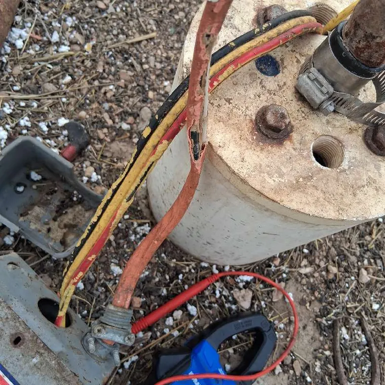 Damaged wiring on well pump system during repair service in Muskogee, Oklahoma