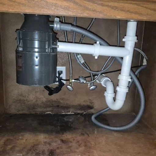 Clog Hunter replacing a garbage disposal and under-sink plumbing