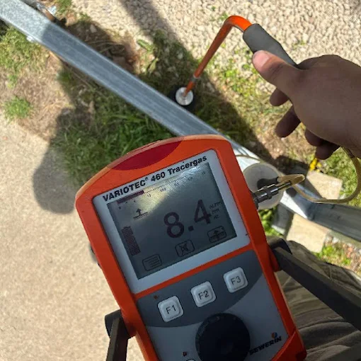Clog Hunter using a gas leak detector on a service call