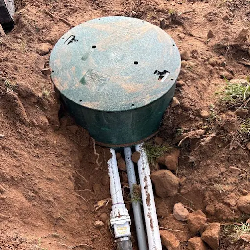 Clog Hunter installing a riser on a septic tank