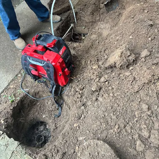 Clog Hunter clearing a sewer line with a drum machine